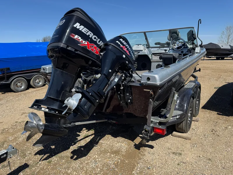 Slide: The Image of 2016 Tuffy Osprey 2100 boat with dual Mercury engines on a trailer. - 3