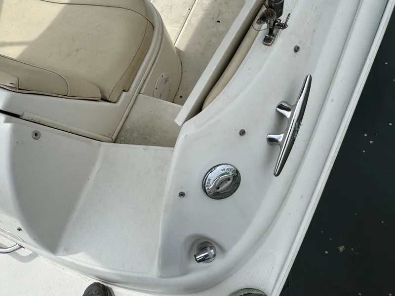 Slide: The Image of 2001 Sea Ray 240 Sundeck interior detail with seating and control panel. - 17