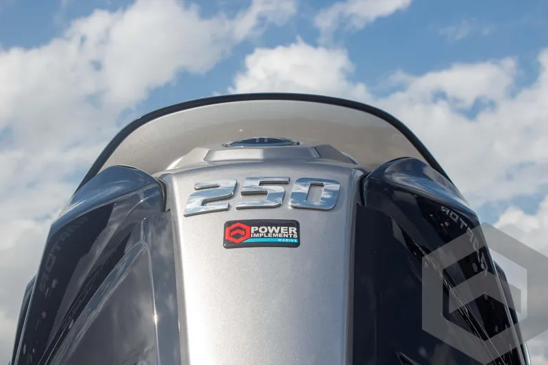 Slide: The Image of 2025 Skeeter ZXR 20 outboard motor with "250" and "Power Implements" branding against a cloudy sky. - 13