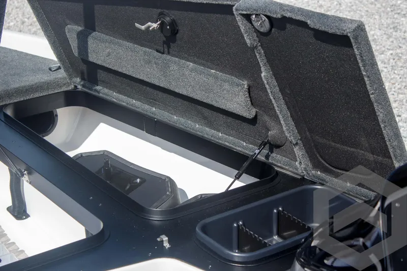 Slide: The Image of Open storage compartment of 2025 Skeeter ZXR 20 boat, showcasing interior design and features. - 24