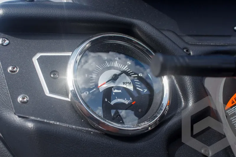 Slide: The Image of Close-up of 2025 Skeeter ZXR 20 dashboard with RPM gauge. - 33