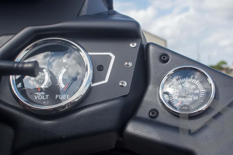Slide: The Image of Dashboard of 2025 Skeeter ZXR 20 boat with volt, fuel, and water gauges. - 34