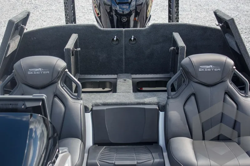 Slide: The Image of 2025 Skeeter ZXR 20 boat interior with dual seats and carpeted deck. - 40