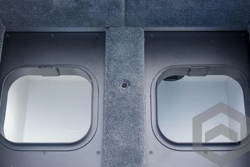 Slide: The Image of 2025 Skeeter ZXR 20 boat storage compartments with carpeted interior. - 41