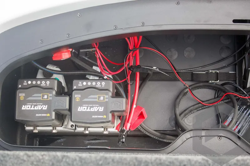 Slide: The Image of Battery compartment of 2025 Skeeter ZXR 20 boat with wiring and components. - 45
