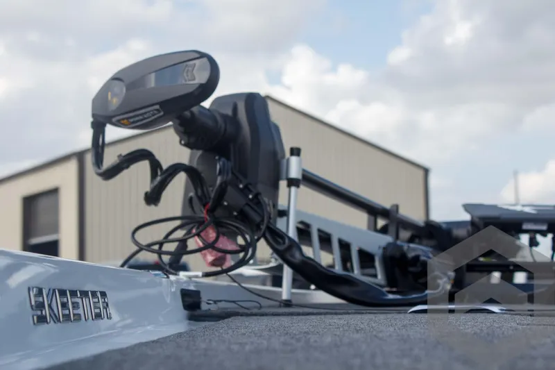 Slide: The Image of 2025 Skeeter ZXR 20 boat with advanced motor, outdoor setting, cloudy sky. - 47