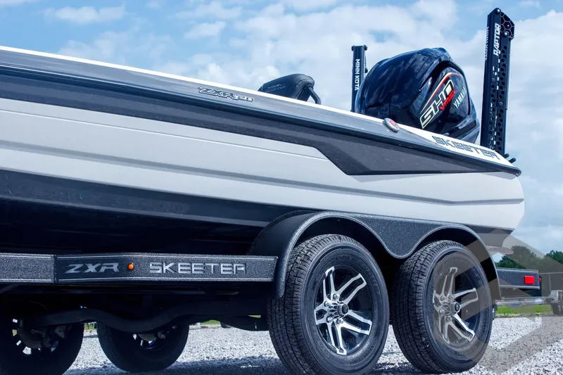 Slide: The Image of 2025 Skeeter ZXR 20 boat on trailer, showcasing sleek design and powerful engine. - 9