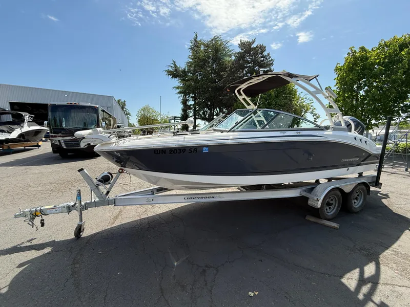 Slide: The Image of 2018 Chaparral 21 Deluxe H20 Ski and Fish boat on trailer, parked outdoors. - 3