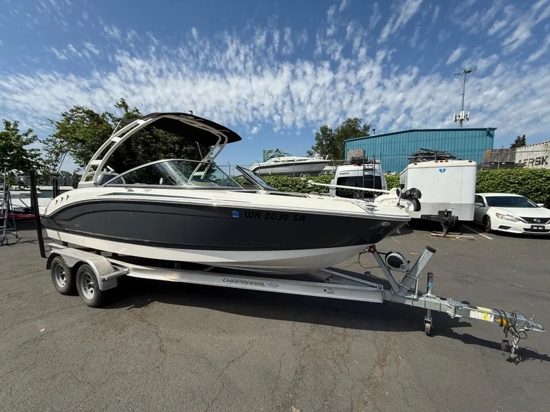 Slide: The Image of 2018 Chaparral 21 Deluxe H20 Ski and Fish boat on trailer, parked outdoors. - 4