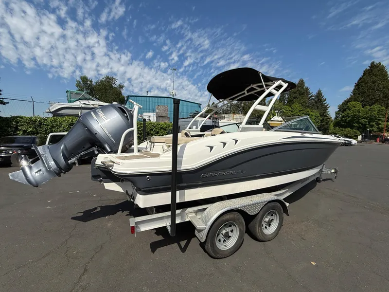 Slide: The Image of 2018 Chaparral 21 Deluxe H20 Ski and Fish boat on trailer, parked outdoors. - 5