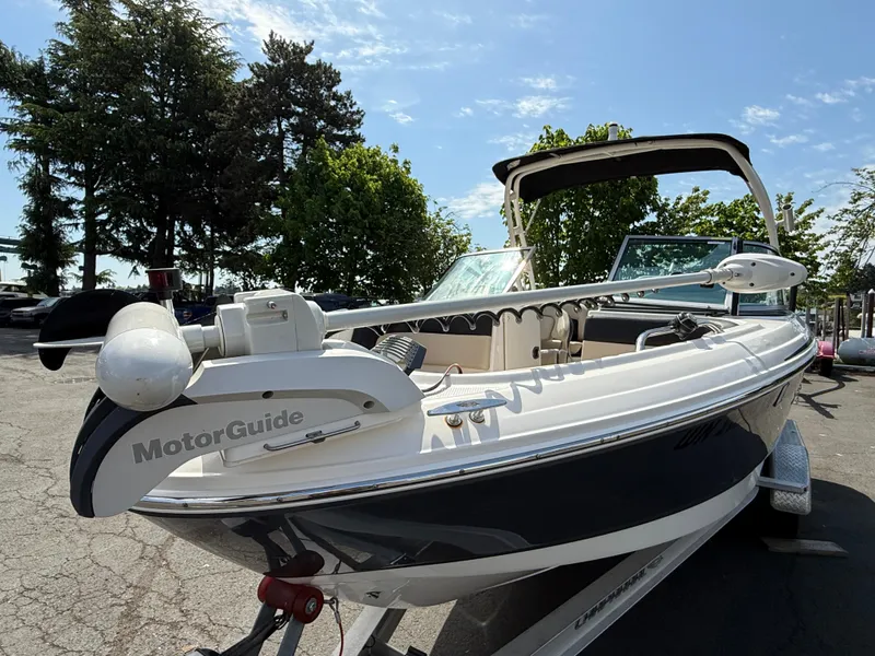 Slide: The Image of 2018 Chaparral 21 Deluxe H20 Ski and Fish boat with MotorGuide, parked outdoors. - 6