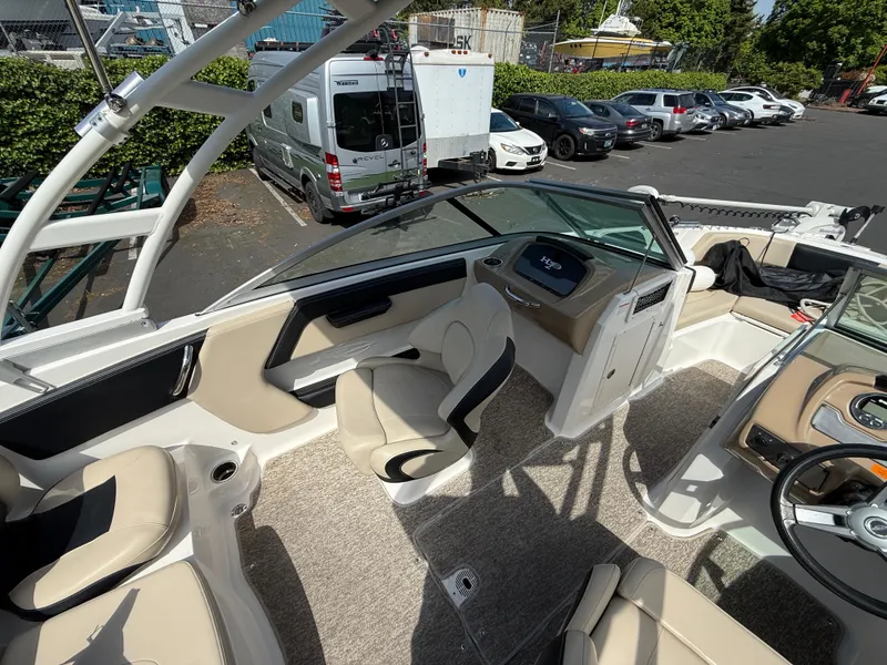 Slide: The Image of 2018 Chaparral 21 Deluxe H20 Ski and Fish boat interior with seating and dashboard. - 8