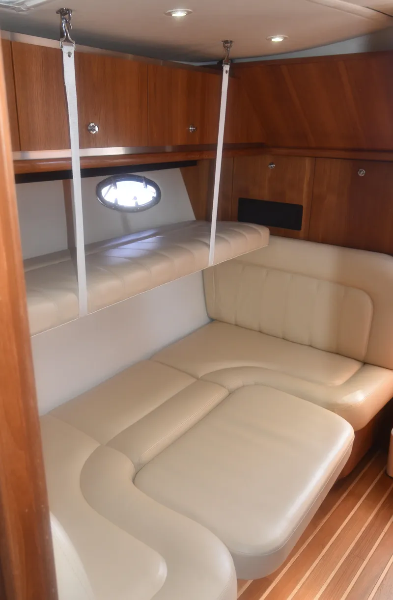 Slide: The Image of 2006 Tiara Yachts 36 Open interior with leather seating and wooden cabinetry. - 15