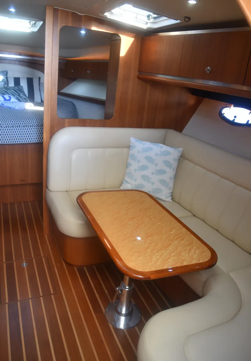 Slide: The Image of 2006 Tiara Yachts 36 Open interior with elegant seating and wooden table. - 18