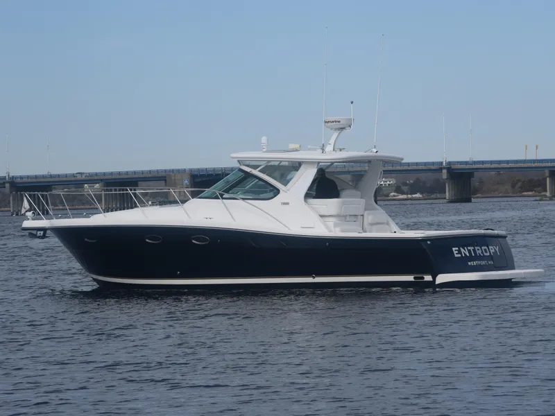 Slide: The Image of 2006 Tiara Yachts 36 Open cruising on water near a bridge. - 2