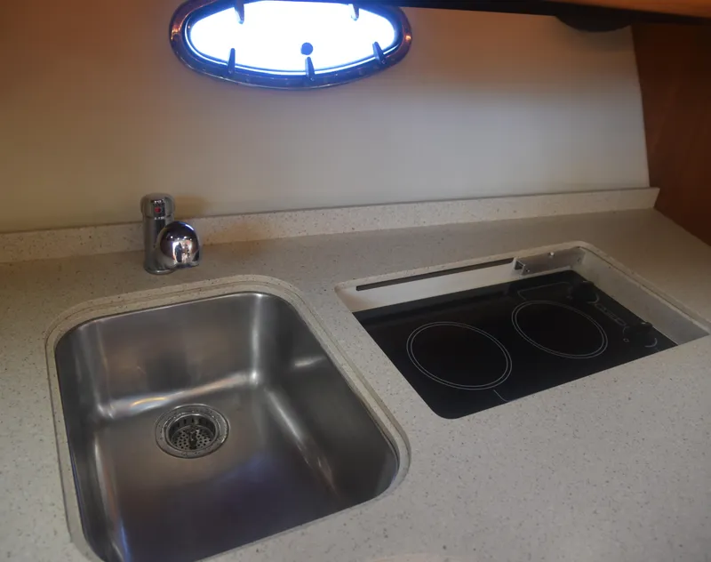 Slide: The Image of 2006 Tiara Yachts 36 Open kitchen with sink and stovetop. - 22