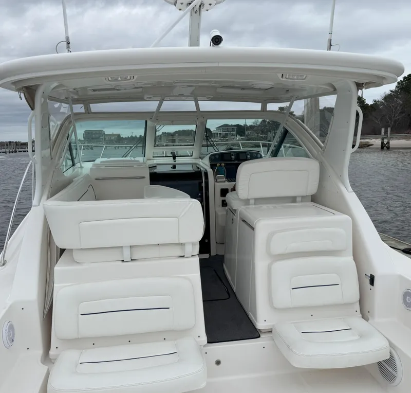 Slide: The Image of 2006 Tiara Yachts 36 Open boat interior with white seating and helm station. - 26