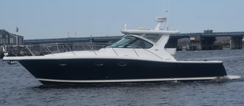 Slide: The Image of 2006 Tiara Yachts 36 Open cruising on water near a bridge. - 28