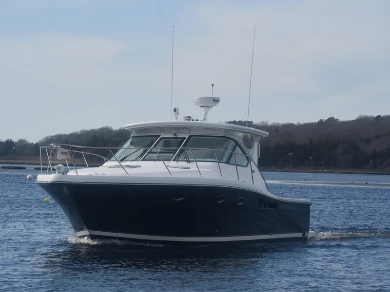 Slide: The Image of 2006 Tiara Yachts 36 Open cruising on calm waters, scenic background. - 3