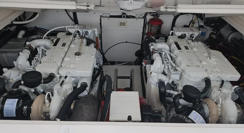Slide: The Image of Engine compartment of a 2006 Tiara Yachts 36 Open, featuring dual inboard engines. - 31