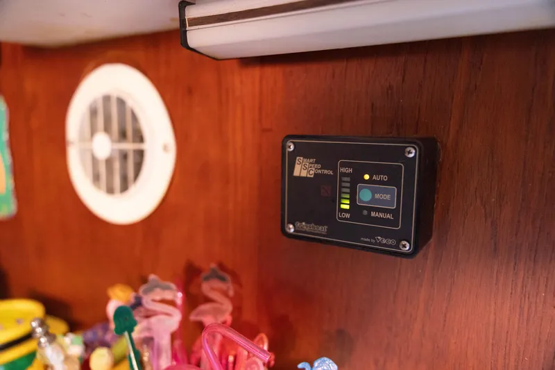 Slide: The Image of Control panel inside 1983 Morgan Out Island 41 yacht, with colorful items nearby. - 18