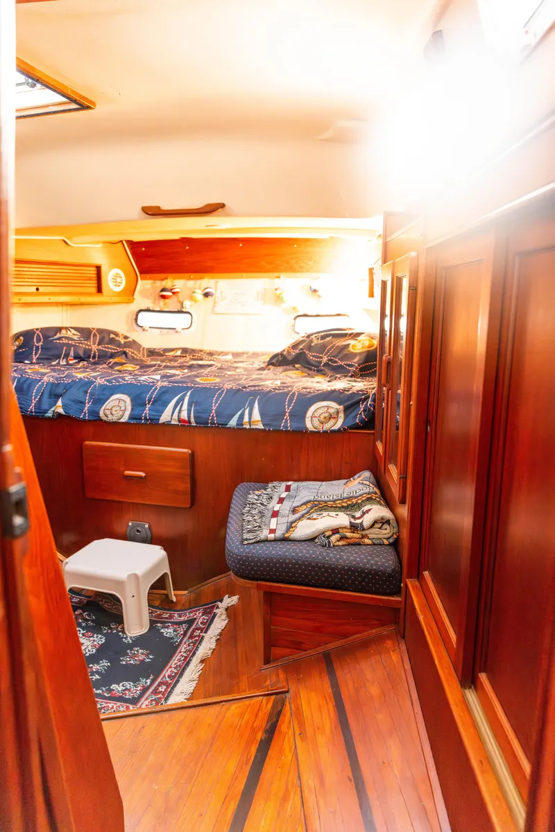 Slide: The Image of Cozy cabin interior of 1983 Morgan Out Island 41 sailboat with nautical decor. - 22