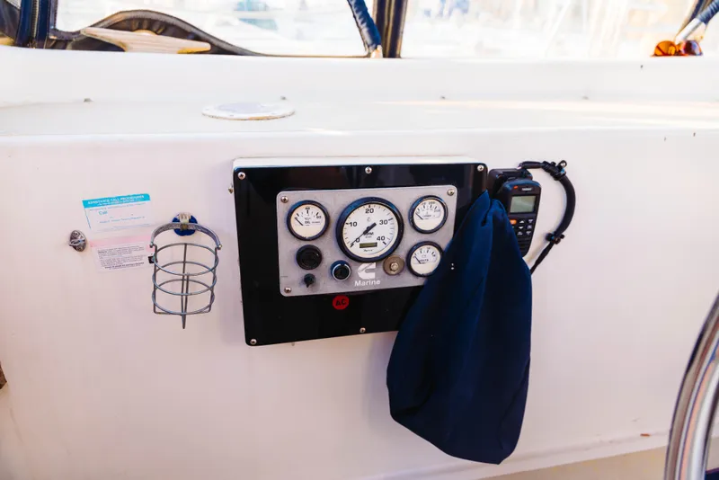 Slide: The Image of Control panel of 1983 Morgan Out Island 41 sailboat with gauges and radio. - 26