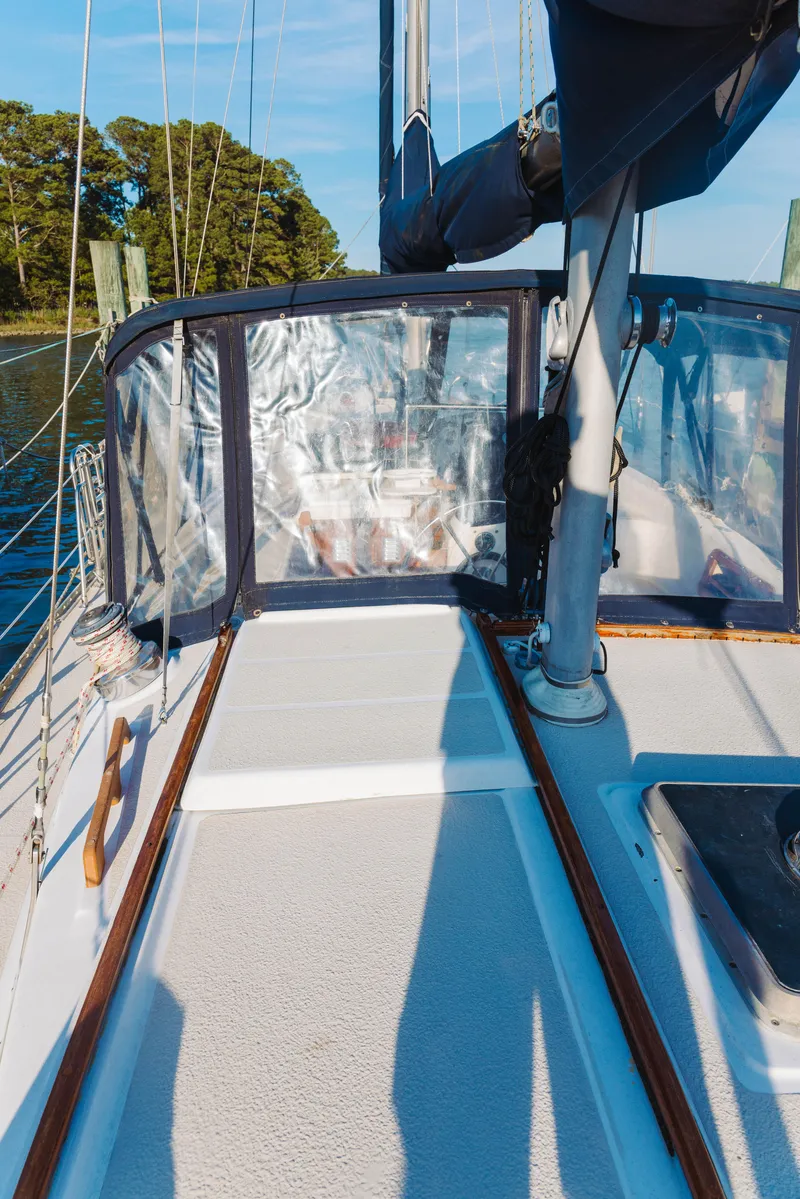 Slide: The Image of 1983 Morgan Out Island 41 sailboat deck with clear cockpit enclosure. - 6