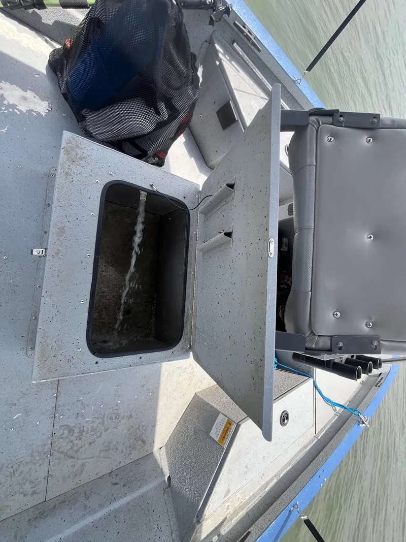 Slide: The Image of 2017 G3 20 CCJ DLX boat interior with open storage compartment and seating. - 31
