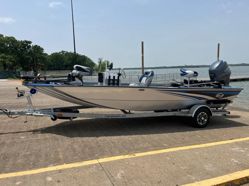 Slide: The Image of 2017 G3 20 CCJ DLX boat on trailer by lakeside dock. - 6
