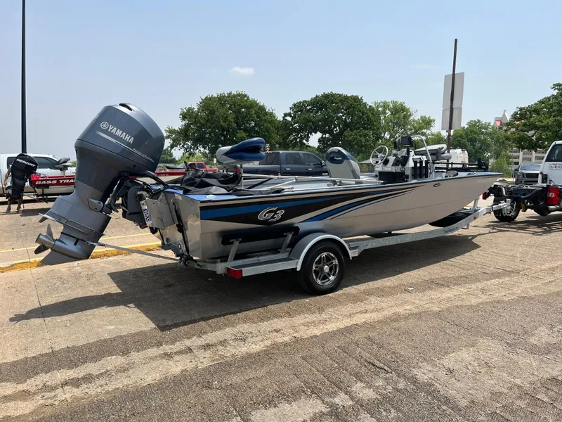 Slide: The Image of 2017 G3 20 CCJ DLX boat with Yamaha motor on trailer in parking lot. - 11