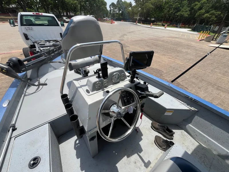 Slide: The Image of 2017 G3 20 CCJ DLX boat interior with steering wheel and control panel. - 16