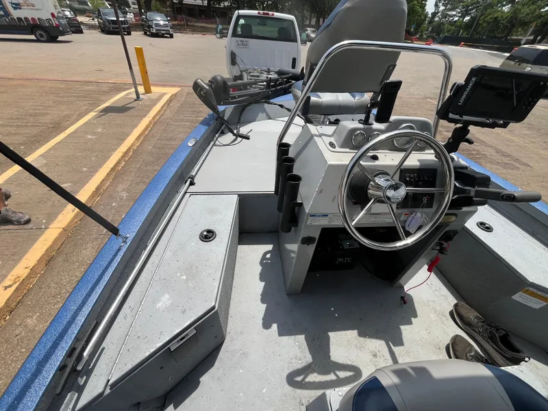 Slide: The Image of 2017 G3 20 CCJ DLX boat interior with steering wheel and control panel. - 17