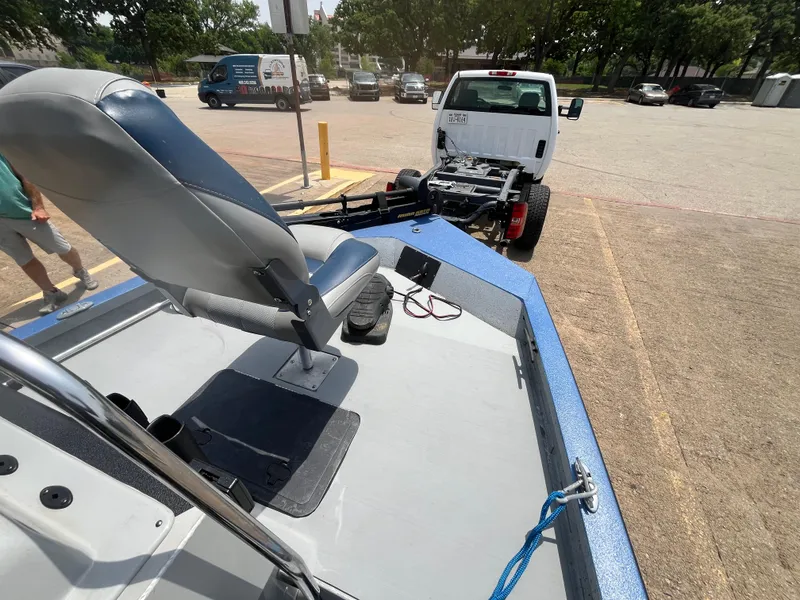 Slide: The Image of 2017 G3 20 CCJ DLX boat on trailer, parked in a lot with a white truck. - 18