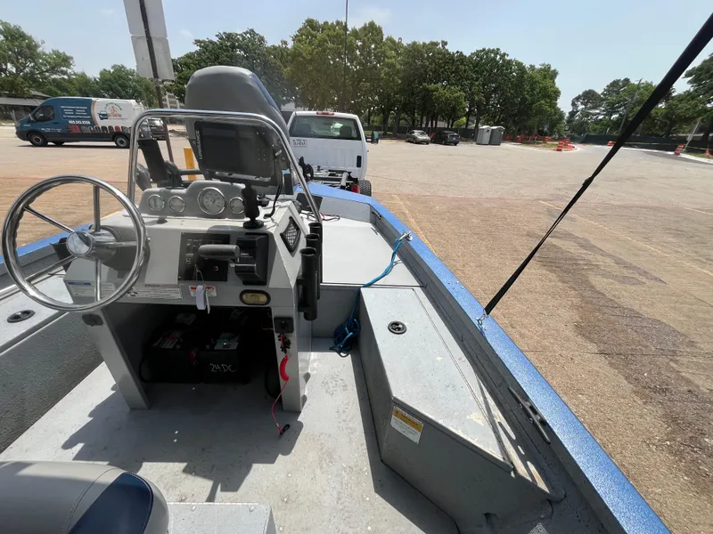 Slide: The Image of 2017 G3 20 CCJ DLX boat interior with steering wheel and control panel. - 19