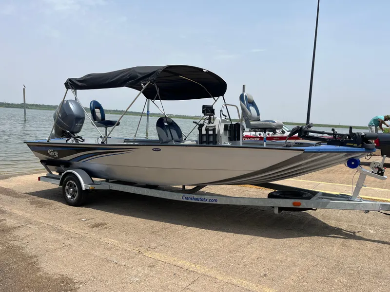 Slide: The Image of 2017 G3 20 CCJ DLX boat on trailer by the lake. - 24