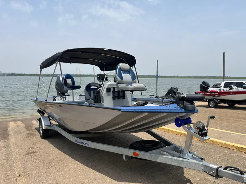 Slide: The Image of 2017 G3 20 CCJ DLX boat on trailer by a lake, ready for launch. - 25