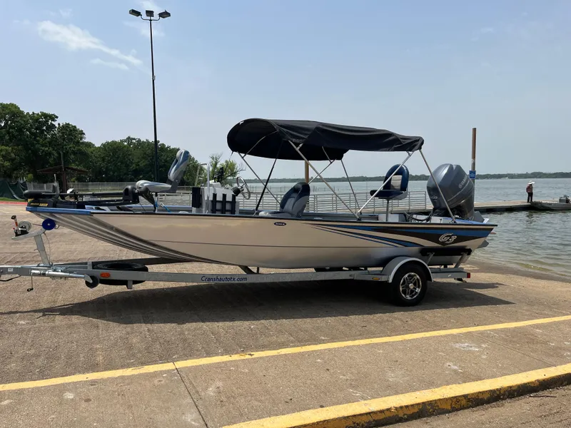 Slide: The Image of 2017 G3 20 CCJ DLX boat on trailer by lakeside, under clear sky. - 28