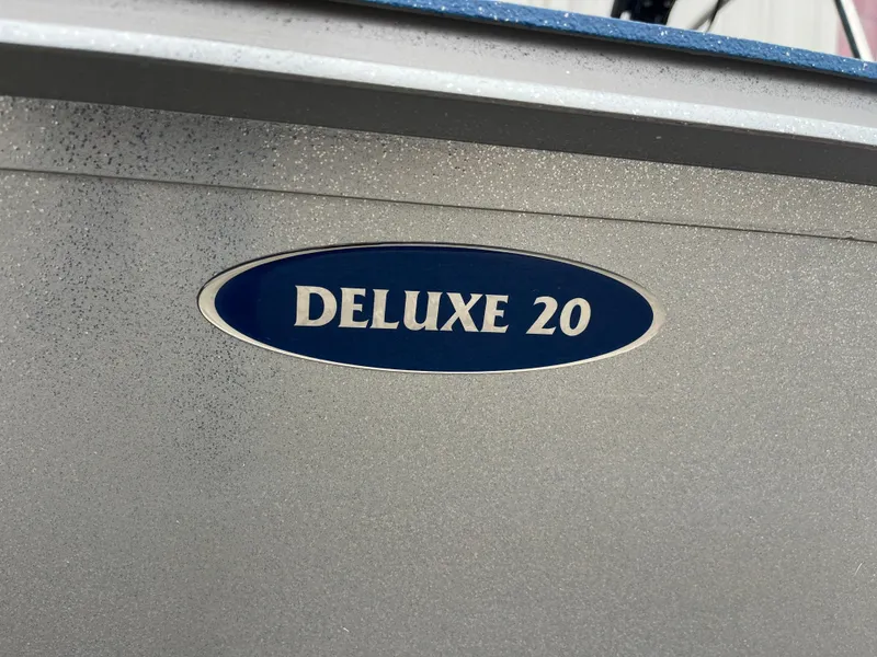 Slide: The Image of 2017 G3 20 CCJ DLX boat with 'Deluxe 20' emblem on silver surface. - 35