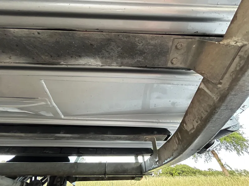 Slide: The Image of Underside view of a 2017 G3 20 CCJ DLX boat, showing metal framework and hull. - 39