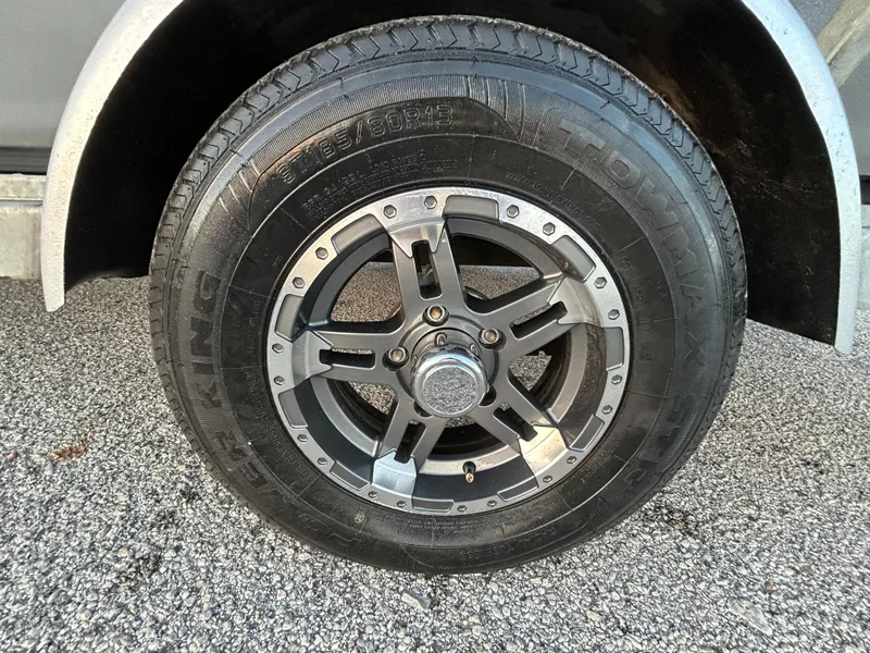 Slide: The Image of 2017 G3 20 CCJ DLX trailer tire on gravel surface. - 45