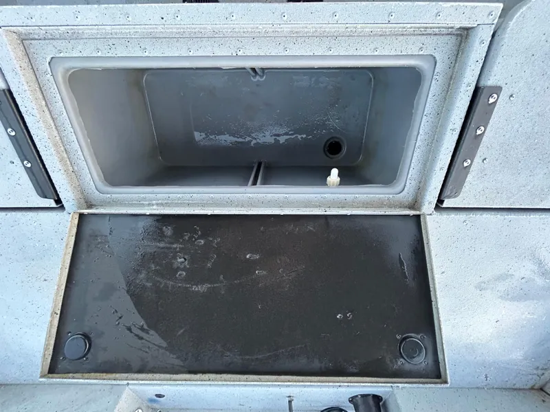 Slide: The Image of Open storage compartment on a 2017 G3 20 CCJ DLX boat. - 48