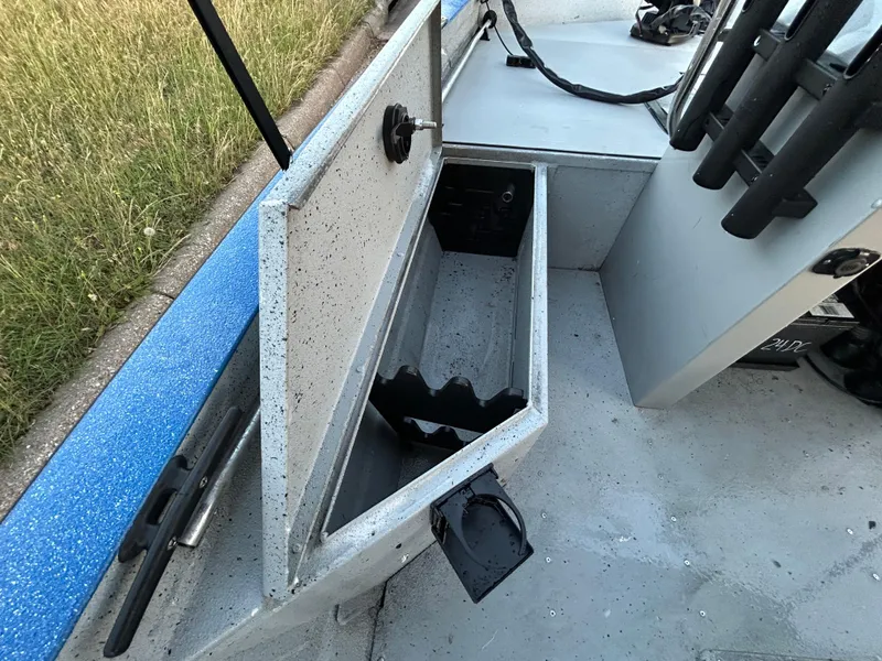Slide: The Image of 2017 G3 20 CCJ DLX boat storage compartment open, showing interior space. - 49