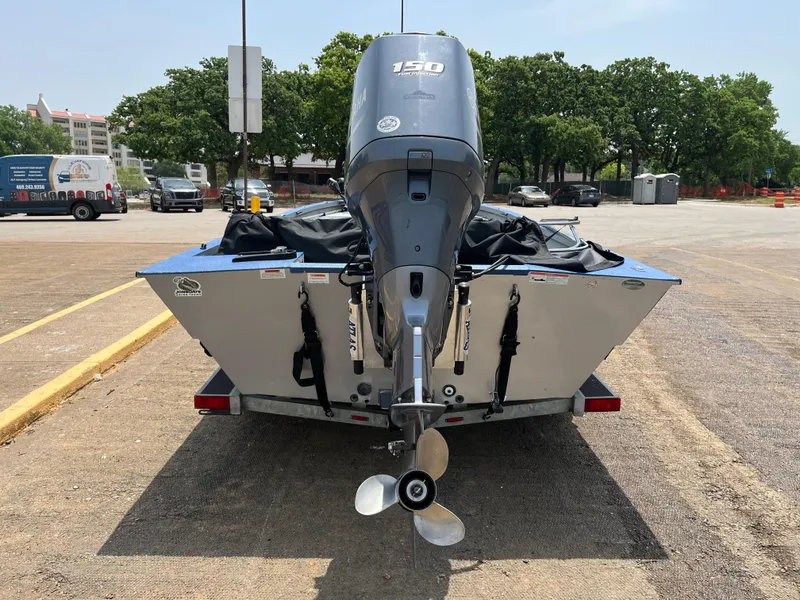 Slide: The Image of 2017 G3 20 CCJ DLX boat with 150 HP engine on trailer, parked outdoors. - 5
