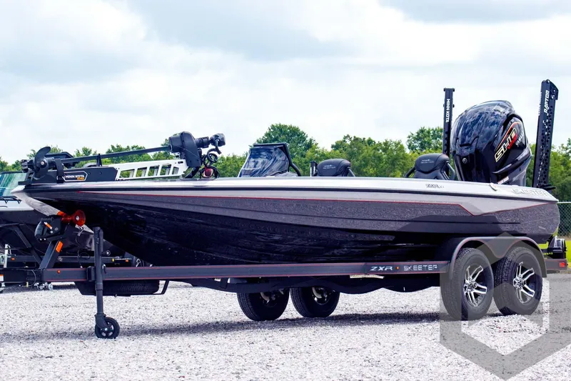 Slide: The Image of 2025 Skeeter ZXR 21 boat on trailer, sleek design, dual axles, outdoor setting. - 1