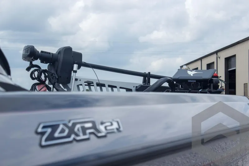 Slide: The Image of 2025 Skeeter ZXR 21 boat close-up with cloudy sky background. - 13