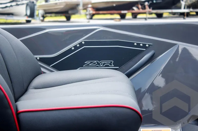 Slide: The Image of 2025 Skeeter ZXR 21 boat interior with sleek black and red seating. - 14