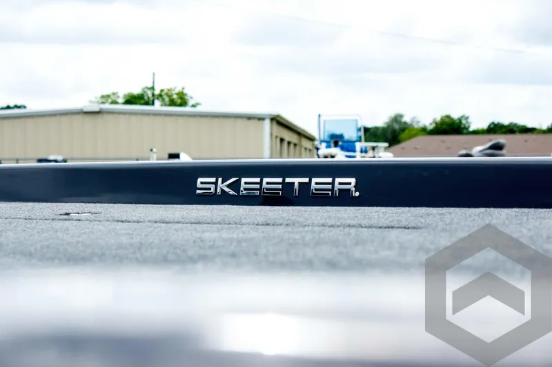 Slide: The Image of 2025 Skeeter ZXR 21 boat logo on a sleek surface, outdoor setting. - 16