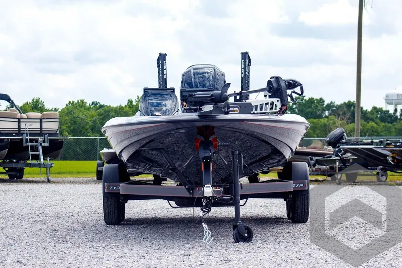 Slide: The Image of 2025 Skeeter ZXR 21 boat on trailer, front view, parked outdoors. - 2