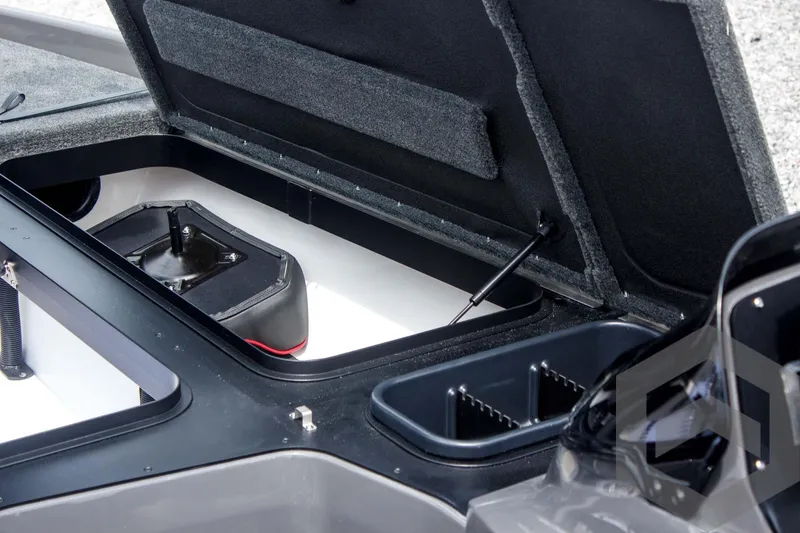 Slide: The Image of Open storage compartment of 2025 Skeeter ZXR 21 boat, showcasing interior features. - 25